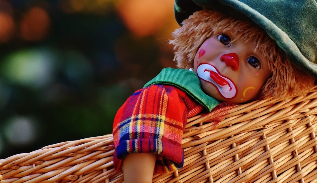 Sad Clown Doll in a Basket